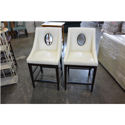 2 WHITE LEATHER PORTHOLE CHAIRS