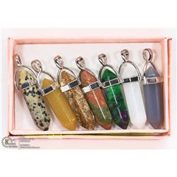 LOT OF 7 ASSORTED SEMI PRECIOUS STONE PENDANTS.