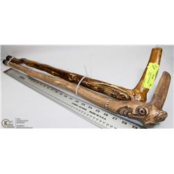 TWO HAND CARVED WOODEN WALKING STICKS