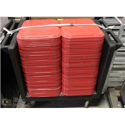PUSH CART FULL OF RED TRAYS