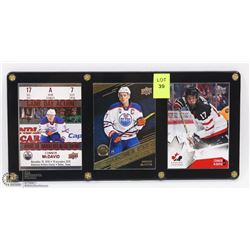3 CONNOR MCDAVID HOCKEY CARDS IN CASE.
