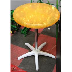 YELLOW PATIO TABLE. LIGHTS UP