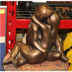 EMBRACED COUPLE FIGURINE