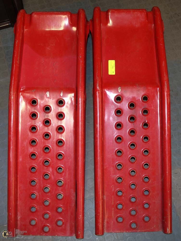 ONE SET OF RED METAL CAR RAMPS.