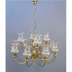 A modern brass twelve branch chandelier, with smoked glass shades, Width 2ft 6ins...