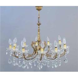 A modern gilt brass twelve branch chandelier, with cut glass pens and drops, Width 2ft 4ins...