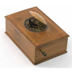 A 19th century singing bird automaton, in mahogany box with oval lid and floral pierced grille (a...