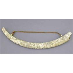 A 19th century German carved ivory elephant tusk, decorated throughout with mythological beasts,...