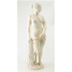 A Victorian carved alabaster figure of a nude slave girl, standing in chains, beside a pillar, (r...