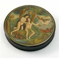 A 19th century painted papier mache snuff box, decorated circular top of Adam and Eve in Paradise...