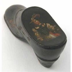 A 19th century papier mache shoe shaped snuff box, hinged lid painted with a maiden 3ins...