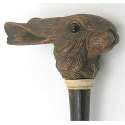 A finely carved hare's head umbrella handle, with ivory collar and cane 28ins...