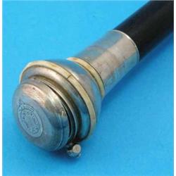 A rosewood walking stick, the associated silver handle mounted with a sovereign case and ivory ba...