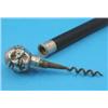 Image 1 : An ebonised walking stick, with associated plated novelty corkscrew handle, modelled as a male he...