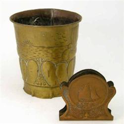 An Arts and Crafts style brass jardiniere, embossed with a maritime scene and a copper letter rac...