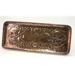 A Newlyn Arts and Crafts embossed rectangular copper tray, decorated with an allover design of sh...