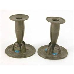 A pair of Liberty English pewter candlesticks, designed by Archibald Knox with blue green enamel...