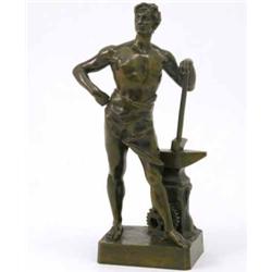 A 19th century French bronze figure of a blacksmith, standing with a hammer at an anvil, impresse...