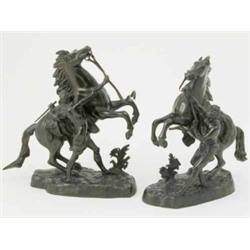 Coustou, a pair of 19th century French bronze figures, of Marly horses, cast on naturalistic base...