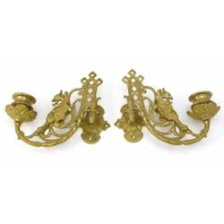 A pair of brass wall sconces, branches cast with winged gryphon and trellis design...
