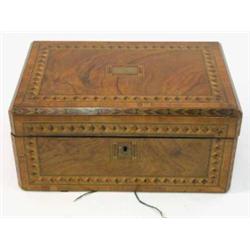 A Continental walnut and mahogany parquetry writing slope, the lid and front panel inlaid with ge...