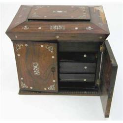 A Regency rosewood and mother-of-pearl inlaid jewellery casket, the sarcophagus shaped lid and sw...