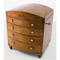 A Regency mahogany and satinwood inlaid bowfront miniature cabinet chest, the hinged lid releasin...
