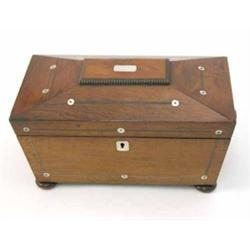 A Regency rosewood sarcophagus shaped two division tea caddy, inlaid with mother-of-pearl, with t...