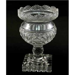 A 19th century glass vase, deeply cut with diamonds, on faceted knop stem and square base, 7.25in...