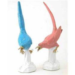 A pair of Mintons bone china magpies, one glazed in blue, the other in pink, both with gilded det...