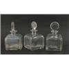 Image 1 : Three 19th century glass decanters, square shape with engraved foliage, complete with target stop...