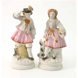 A pair of biscuit porcelain figures, male beside basket, female with dog, on circular bases, 9.5i...