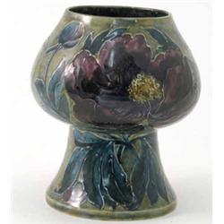 A Hancock & Sons "Morrisware" vase, of pedestal shape, tube-lined with blue and mauve foliage aga...