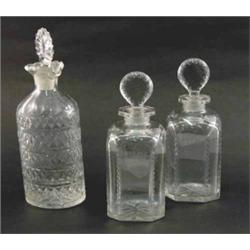 A pair of George III spirit decanters, engraved 'Rum' and 'Shrub', each with cut decoration and s...