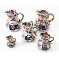 Five various ironstone hydra jugs, all octagonal and painted with Japan patterns, three faulty...