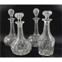 A pair of cut glass decanters, of globe and shaft form (12in.) and two other decanters, each with...