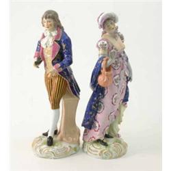 A pair of 19th century Thuringian porcelain figures, gallant and female companion, he wearing gil...