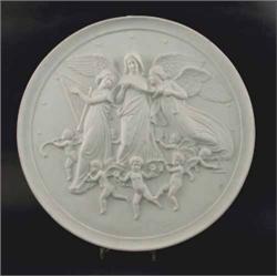 A Royal Copenhagen circular bisque wall plaque, moulded with a cherub group, 14in....
