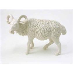 A porcelain goat, 10in. long...