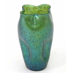 A Loetz iridescent green glass vase, with undulating rim and pinched body, 10in....