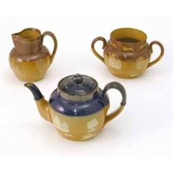 A Royal Doulton glazed stoneware teapot, with silver mount (5in.), a Royal Doulton harvest jug (4...