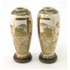 Image 1 : A pair of Satsuma vases, Meiji period, each painted with a landscape panel and wild flowers, on s...