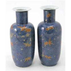A pair of 19th century Chinese rouleau vases, painted with fish in iron-red and gilt against a po...