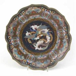 A 19th century Japanese cloisonne wall plate, enamelled with a phoenix and stylised foliage again...
