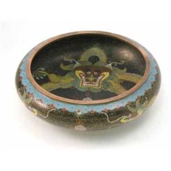 A 19th century Japanese cloisonne bowl, enamelled with a dragon and flaming pearl against a black...