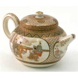 A Satsuma teapot, decorated with panels of figures, 3ins, (spout chipped)...