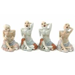 Four Kutani figures of seated emaciated men, 4.5ins...