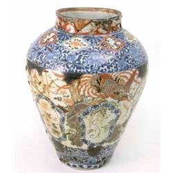 An 18th century Imari baluster vase, decorated with birds and flowers, (rivetted) 15.5ins...