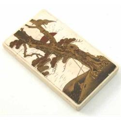 A Japanese lacquered ivory card case, decorated with fujiyama and a sunset through trees, 4.5ins...