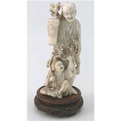 A Japanese carved ivory okimono, of a farmer and boy holding a prunus branch, signed, 8 ins....